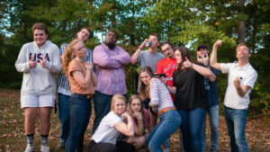 Group of college students strike silly poses for a picture