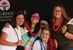 Four female college students pose for a picture together