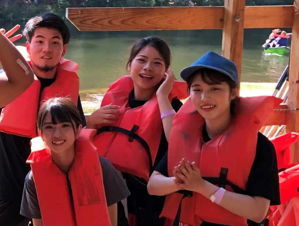 International students pose with life jackets on.