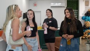 Group of sorority girls standing in a circle talking